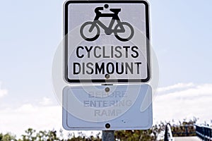 Cyclists To Dismount Signs