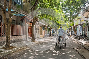 Cyclo on a quiet street in old Hue Vietnam