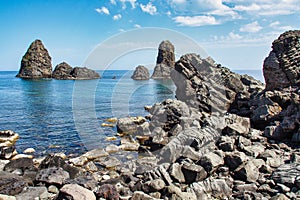 Cyclops island, basaltic rock fomation in Aci Trezza, Catania, Sicily, Italy.
