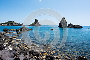 Cyclops islands, Acitrezza, Sicily. Basalt  rocks on the sea