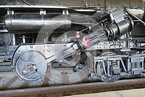 Cylinder, rod and wheels for steam engine train.