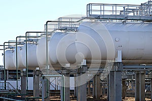 cylinders and pipes at an oil refinery plant.