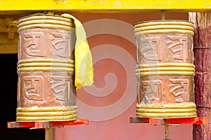 Cylinders with symbols in Sanskrit for meditation