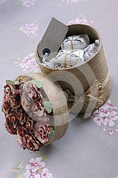 Cylindrical gift box filled with presents