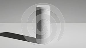 A cylindrical object with a textured surface stands upright on a white surface.