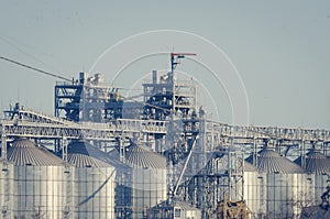 Cylindrical silos for grain storage.