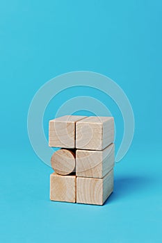 cylindrical toy block among rectangular toy blocks photo