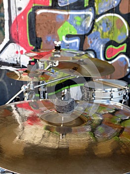 Cymbals on a drumkit with graffiti photo