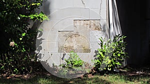 Cynderblock eroding on the lower part of home photo