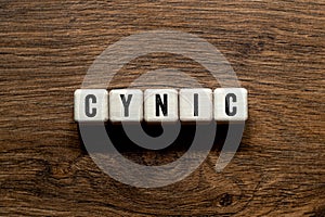 Cynic - word concept on building blocks, text