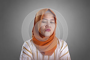 Cynical Muslim Woman Looking to the Side