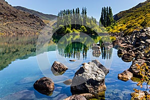 Cypress alley and huge basalt boulders