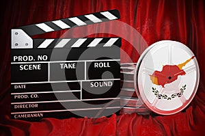 Cypriot cinematography, film industry, cinema in Cyprus. Clapperboard with and film reels on the red fabric, 3D rendering