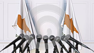 Cypriot official press conference. Flags of Cyprus and microphones. Conceptual 3D animation