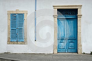 Cypriot old house with blue door and window