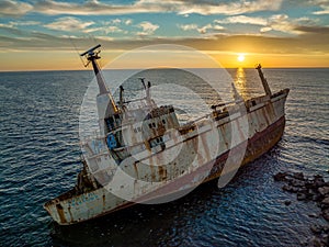 Cyprus - Abandoned shipwreck EDRO III in Pegeia, Paphos, Cyprus from drone view at amazing sunset time