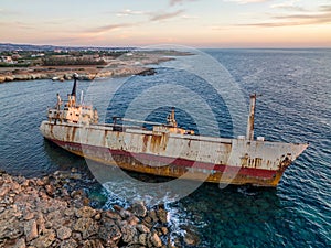 Cyprus - Abandoned shipwreck EDRO III in Pegeia, Paphos, Cyprus from drone view at amazing sunset time