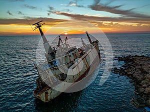 Cyprus - Abandoned shipwreck EDRO III in Pegeia, Paphos, Cyprus from drone view at amazing sunset time