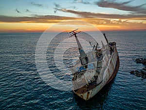 Cyprus - Abandoned shipwreck EDRO III in Pegeia, Paphos, Cyprus from drone view at amazing sunset time