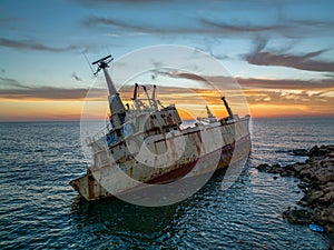 Cyprus - Abandoned shipwreck EDRO III in Pegeia, Paphos, Cyprus from drone view at amazing sunset time