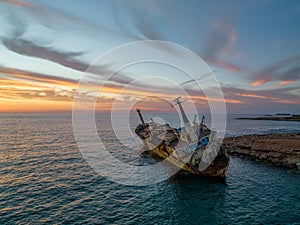 Cyprus - Abandoned shipwreck EDRO III in Pegeia, Paphos, Cyprus from drone view at amazing sunset time