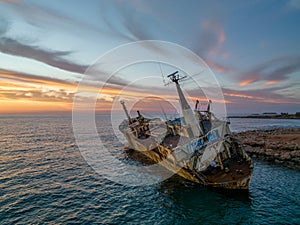 Cyprus - Abandoned shipwreck EDRO III in Pegeia, Paphos, Cyprus from drone view at amazing sunset time