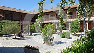 Cyprus. Beautiful summer landscape.	 Monastery courtyard.