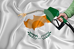 CYPRUS flag Close-up shot on waving background texture with Fuel pump nozzle in hand. The concept of design solutions. 3d