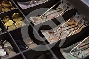 Czech crowns of various denominations in a cash drawer