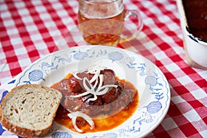 Czech food specialty, roasted small sausages in beer sauce