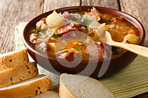 Czech food: Zelnacka cabbage soup with sausages and vegetables c