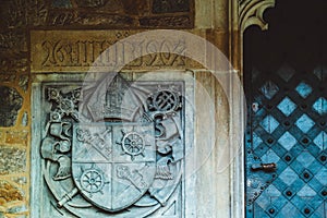 Czech republic, Brno city, gothic heraldry decor on the cathedral facade, coat of arms. Medieval saint art church exterior, armor