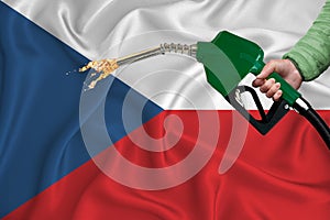 CZECH REPUBLIC flag Close-up shot on waving background texture with Fuel pump nozzle in hand. The concept of design solutions. 3d