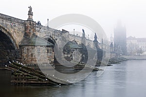 Czech Republic, Prague, Charles Bridge during typical fog autmn atmosphere