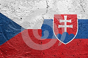 Czech Republic and Slovakia - Cracked concrete wall painted with a Czech flag on the left and a Slovakian flag on the right stock