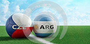 Czech Republic vs. Argentina Soccer Match - Soccer balls in Czech Republic and Argentinas national colors on a soccer field. Copy