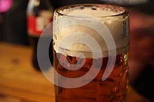 Czech-style Pilsner lager golden beer on table of bar pub restaurant in Prague, Czech Republic