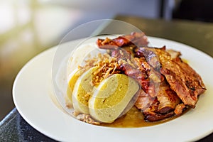 Czech traditional cuisine dumplings cabbage and pork meat on a plate