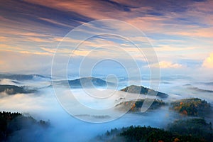 Czech typical autumn landscape. Hills and villages with foggy m