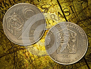 Czechoslovakian koruna coins placed on a vintage map