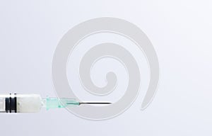 Medical syringe cannula with white background photo