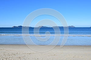 CÃÂ­es islands. Ocean beach.Beautiful white sand beach and ocean waves with clear blue sky