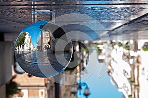 D`Aquino Street in the center of the town of Taranto, in the South of Italy, reflectdd into a Crystal Sphere