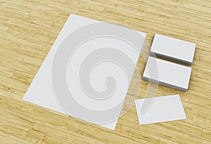 3d Business cards and blank notepads on wooden table.