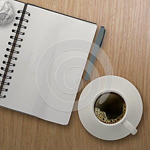 3d cup of coffee in a white cup and blank note book