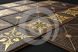 3d hard wood tiles with gold matte elements photo