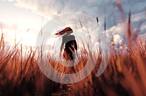 Girl walking alone in grass field