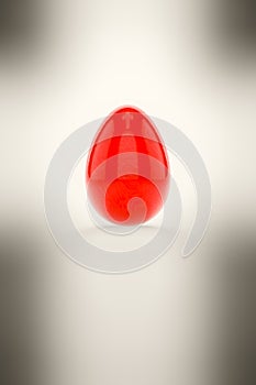 A red easter egg on white background