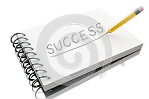 3d Success text on notepad with pencil.