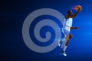 3d illustration young professional basketball player layup on dark blue backgrounds